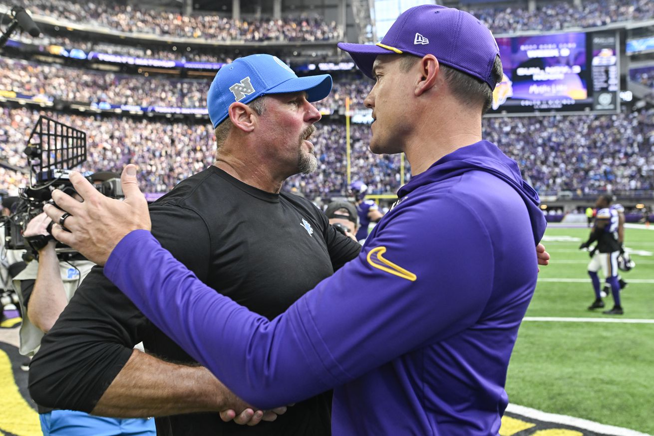 Head coach Kevin O’Connell of the Minnesota Vikings greets head coach Dan Campbell of the Detroit Lions after the Lions defeated the Vikings, 31-29, at U.S. Bank Stadium on October 20, 2024 in Minneapolis, Minnesota.