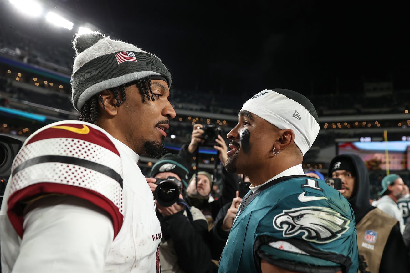 Jayden Daniels #5 of the Washington Commanders talks with Jalen Hurts #1 of the Philadelphia Eagles after the Eagles 26-18 win at Lincoln Financial Field on November 14, 2024 in Philadelphia, Pennsylvania.