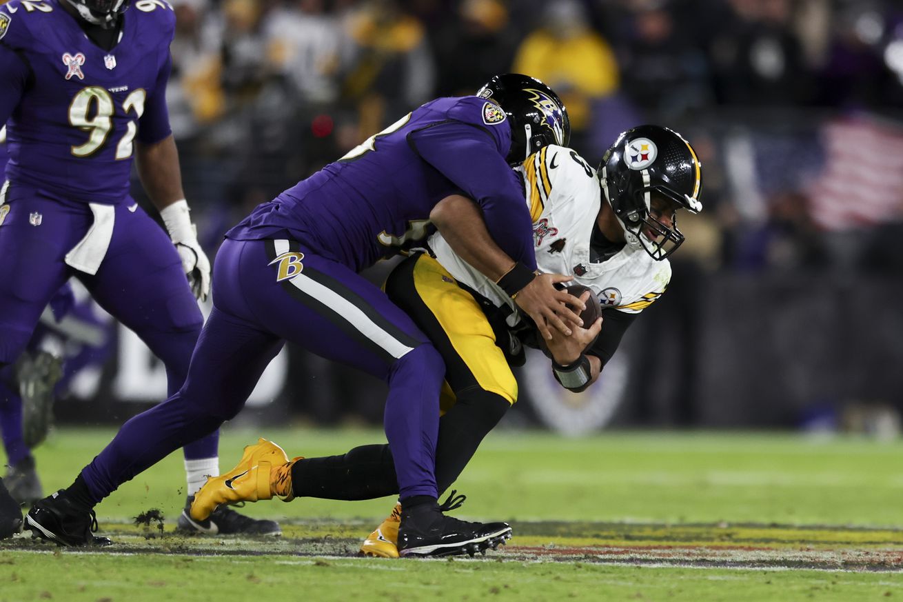 Kyle Van Noy #53 of the Baltimore Ravens sacks Russell Wilson #3 of the Pittsburgh Steelers during a game at M&amp;T Bank Stadium on December 21, 2024 in Baltimore, Maryland.
