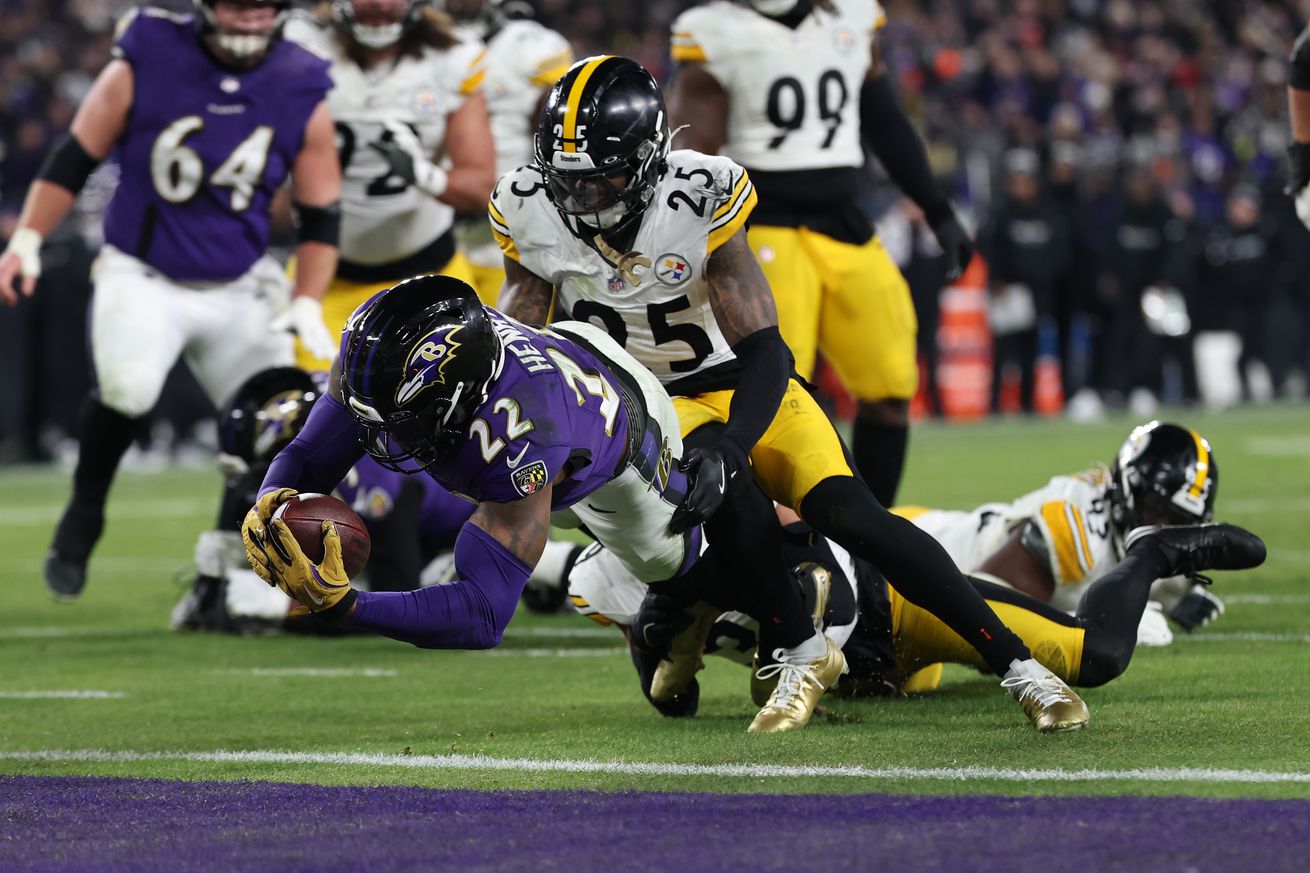 Derrick Henry #22 of the Baltimore Ravens dives for a touchdown against DeShon Elliott #25 of the Pittsburgh Steelers during the second quarter during the AFC Wild Card Playoff at M&amp;T Bank Stadium on January 11, 2025 in Baltimore, Maryland.
