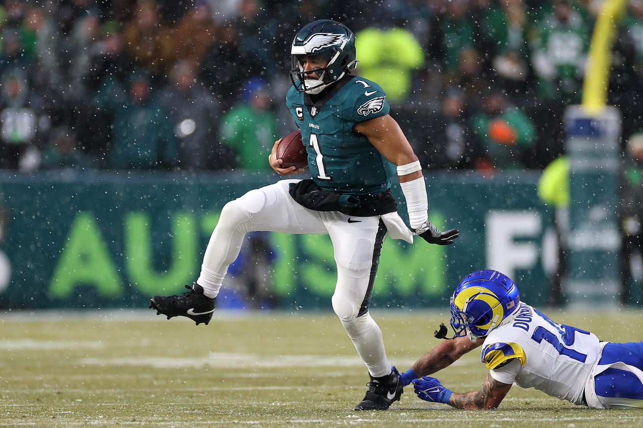Saquon Barkley #26 of the Philadelphia Eagles runs the ball against the Los Angeles Rams during the second quarter in the NFC Divisional Playoff at Lincoln Financial Field on January 19, 2025 in Philadelphia, Pennsylvania.