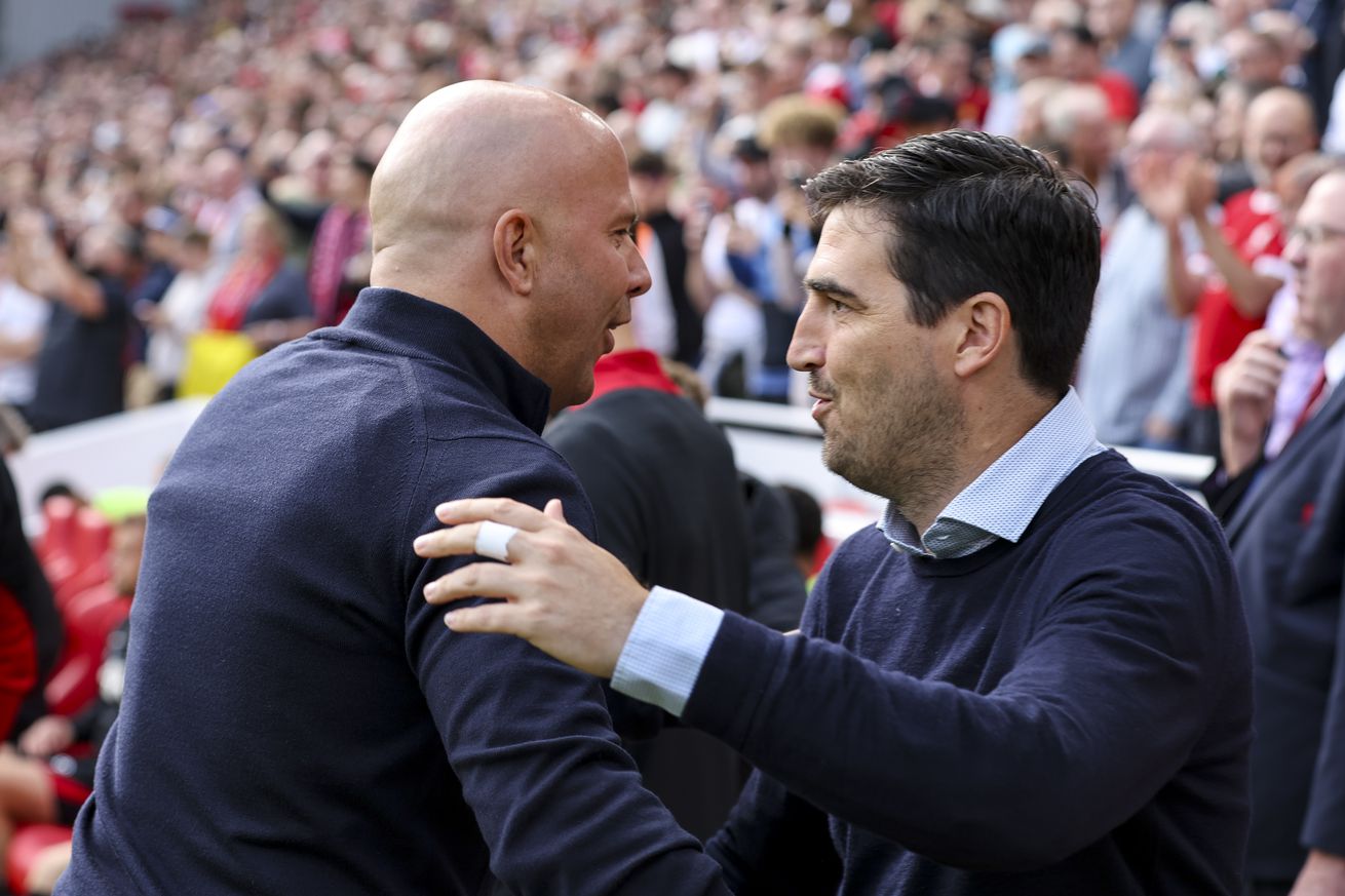 Head Coaches Arne Slot of Liverpool with Andoni Iraola of Bournemouth during the Premier League match between Liverpool FC and AFC Bournemouth at Anfield on September 21, 2024 in Liverpool, England.