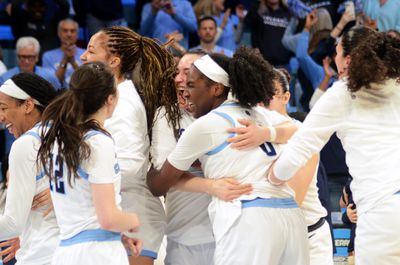 Columbia’s women’s basketball team celebrates on the floor of Carmichael Arena after winning their first-ever NCAA Tournament game on March 20, 2025.