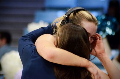 Columbia coach Megan Griffith hugs Kitty Henderson after the Lions beat Washington in the First Four of the NCAA Tournament on Thursday, March 20, 2025.