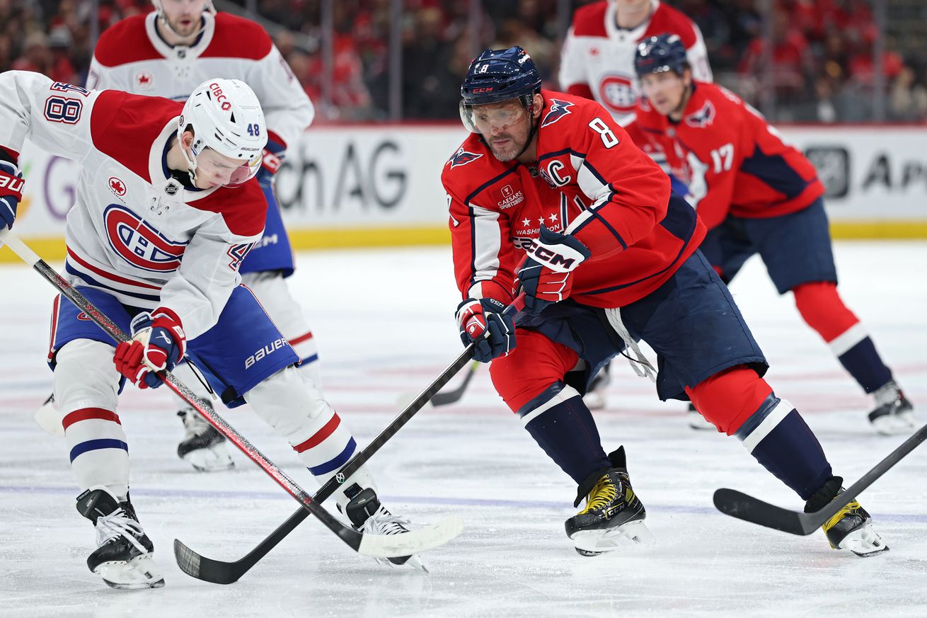Alex Ovechkin #8 of the Washington Capitals battles Lane Hutson #48 of the Montreal Canadiens for the puck during the second period at Capital One Arena on January 10, 2025 in Washington, DC.