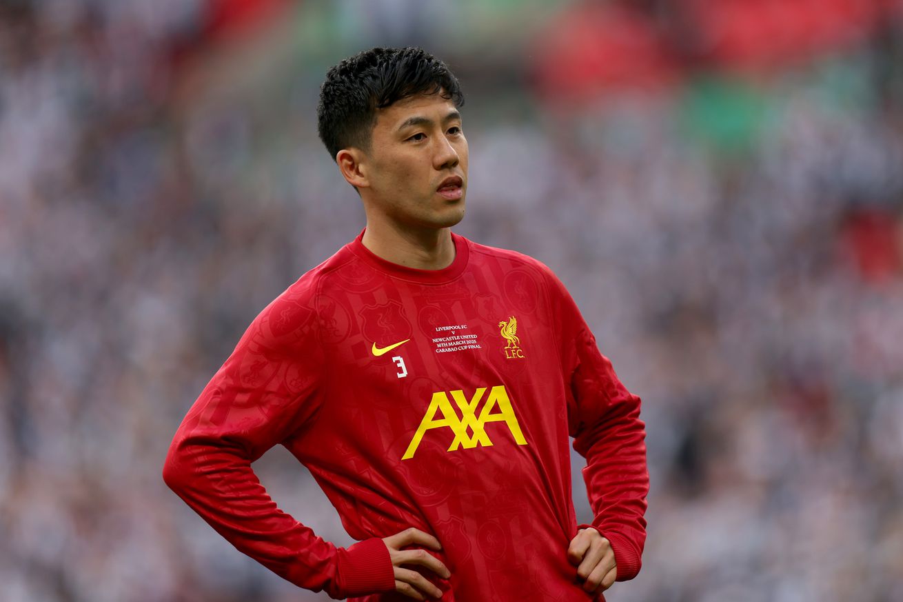 Wataru Endō of Liverpool looks on, during the warm up prior to the Carabao Cup Final between Liverpool and Newcastle United at Wembley Stadium on March 16, 2025 in London, England.