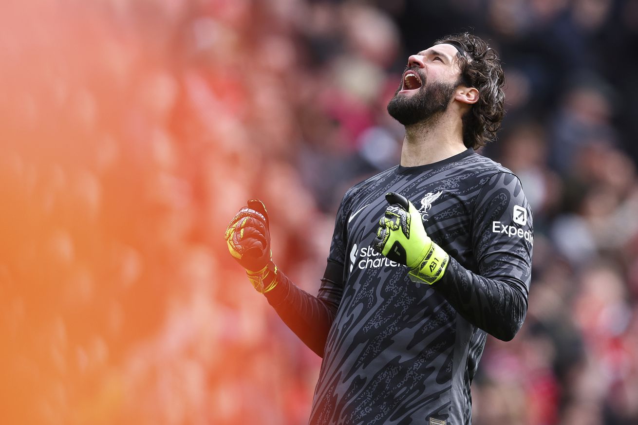 Alisson Becker, goalkeeper of Liverpool celebrates after winning the Premier League match between Liverpool FC and West Ham United FC at Anfield on April 13, 2025 in Liverpool, England.