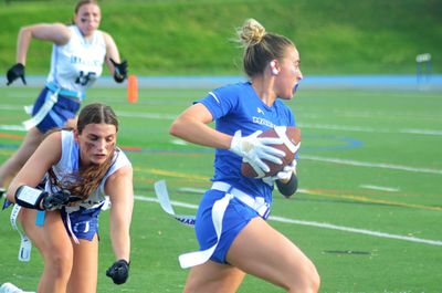 Marymount’s Samantha Bulik outruns and avoids a would-be flag-puller in the semifinals of the Atlantic East Championship for women’s flag football on Saturday, April 26, 2025, in Arlington, Va.