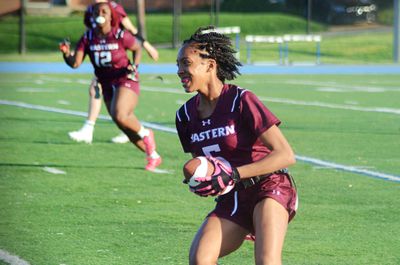 Eastern running back Kyla Massenburg looks for a lane to run through during the Atlantic East Championship for women’s flag football on Saturday, April 26, 2025, in Arlington, Va.